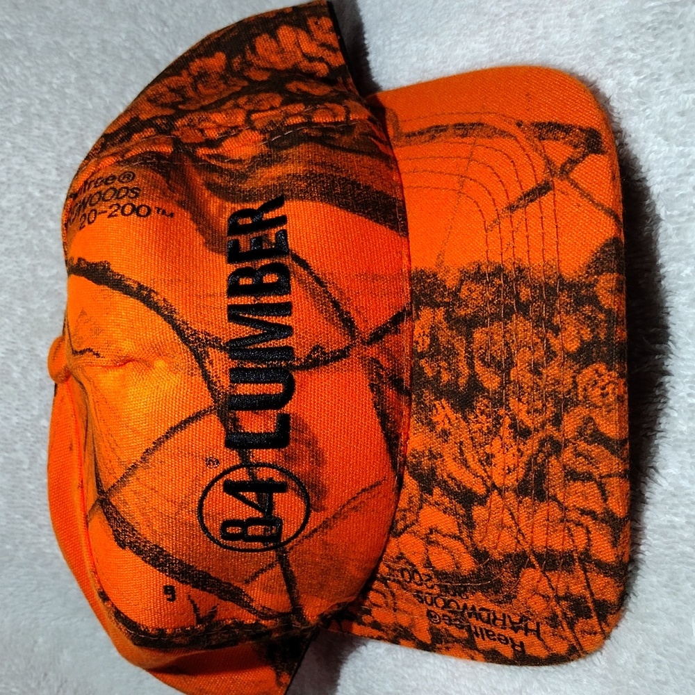 Vintage Trucker Hat: 84 LUMBER Orange Camouflage